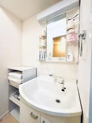 a bathroom with a white sink and a mirror at Ikebukuro-hostel池袋中川301&501-TS0038 in Tokyo