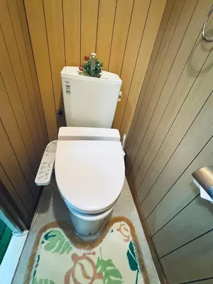 a toilet with a plant on top of it in a bathroom at Ikebukuro-hostel池袋中川301&501-TS0038 in Tokyo
