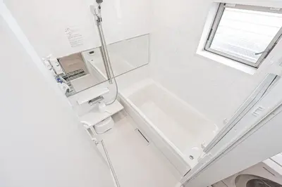 a white bathroom with a sink and a mirror at Private 3 Bedroom House with Free Parking Near Asakusa and Skytree in Tokyo