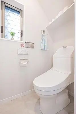 a white bathroom with a toilet and a window at Private 3 Bedroom House with Free Parking Near Asakusa and Skytree in Tokyo