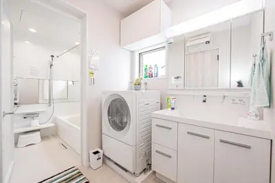 a white bathroom with a washing machine in it at Private 3 Bedroom House with Free Parking Near Asakusa and Skytree in Tokyo