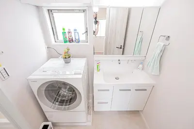 a bathroom with a washing machine and a sink at Private 3 Bedroom House with Free Parking Near Asakusa and Skytree in Tokyo