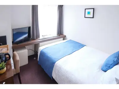 a hotel room with a bed and a television at POD SELECT HOTEL SHINJUKU - Vacation STAY 43667v in Tokyo