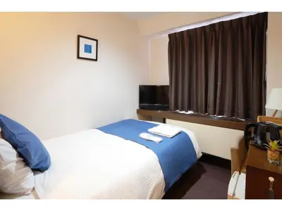 a hotel room with a bed and a window at POD SELECT HOTEL SHINJUKU - Vacation STAY 43667v in Tokyo