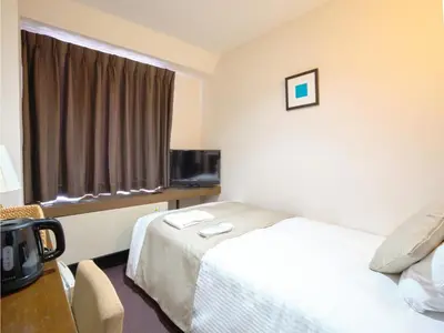 a hotel room with a bed and a television at POD SELECT HOTEL SHINJUKU - Vacation STAY 43667v in Tokyo