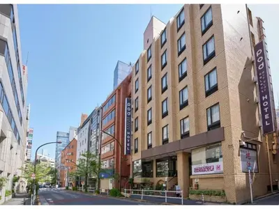 a tall brick building on a city street at POD SELECT HOTEL SHINJUKU - Vacation STAY 43664v in Tokyo