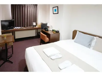 a hotel room with a bed and a desk at POD SELECT HOTEL SHINJUKU - Vacation STAY 43664v in Tokyo