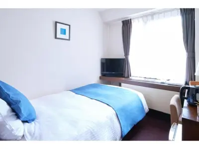 a hotel room with a bed and a window at POD SELECT HOTEL SHINJUKU - Vacation STAY 43665v in Tokyo