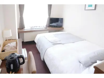 a hotel room with a large bed and a television at POD SELECT HOTEL SHINJUKU - Vacation STAY 43662v in Tokyo