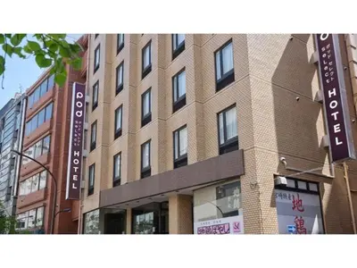 a tall brick building with signs on the side of it at POD SELECT HOTEL SHINJUKU - Vacation STAY 43662v in Tokyo