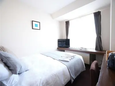 a hotel room with a bed and a window at POD SELECT HOTEL SHINJUKU - Vacation STAY 43662v in Tokyo