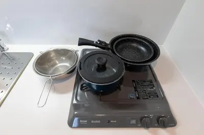 a pot and pans sitting on top of a laptop at Hotel Yoyogi Uehara Tokyo in Tokyo