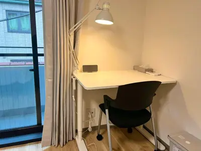 a desk and a chair in a room with a window at 3 Toilets 2 Showers Renovated Shinjuku Large Family Home in Tokyo