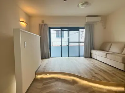 a living room with a couch and a window at 3 Toilets 2 Showers Renovated Shinjuku Large Family Home in Tokyo