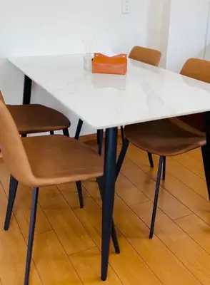 a white table with chairs and a purse on it at Mokuga apartment in Tokyo