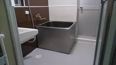 a small bathroom with a sink and a shower at \u6771\u65b0\u5c0f\u5ca95\u4e01\u76ee in Tokyo