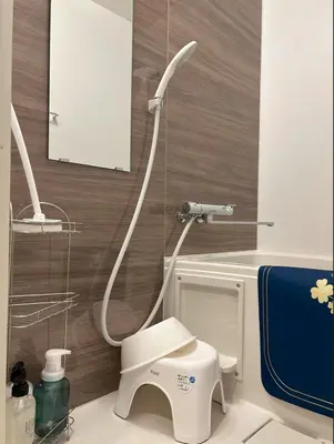 a bathroom with a shower with a toilet and a sink at \u685c\u5c4bSakuraya101 in Tokyo