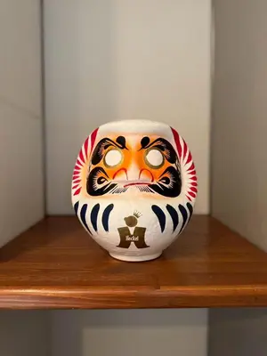 a vase with a tiger face on a shelf at and CITY\u4e09\u8ed2\u8336\u5c4b in Tokyo