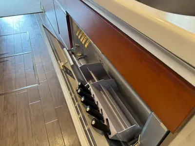 a group of chairs sitting under a counter at and CITY\u4e09\u8ed2\u8336\u5c4b in Tokyo