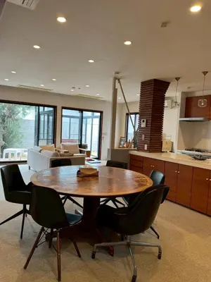 a large kitchen with a wooden table and chairs at and CITY\u4e09\u8ed2\u8336\u5c4b in Tokyo