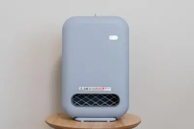 a white modem sitting on a wooden shelf at Sakura Serenity House Komagome in Tokyo