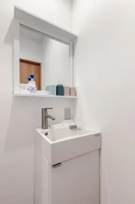 a bathroom with a white sink and a mirror at rot\u6771\u4e0a\u91ce3\u4e01\u76ee401 in Tokyo