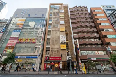 a group of tall buildings in a city at \u5c0f\u6edd\u6a4b\u30d1\u30b7\u30d5\u30a3\u30ab\u30d3\u30eb in Tokyo