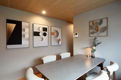 a dining room with a table and white chairs at \u4e80\u4e43\u5eb5Kamenoan in Tokyo