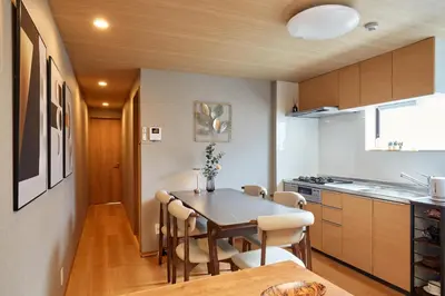 a kitchen and dining room with a table and chairs at \u4e80\u4e43\u5eb5Kamenoan in Tokyo