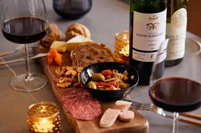 a table with a plate of food and a bottle of wine at \u4e80\u4e43\u5eb5Kamenoan in Tokyo