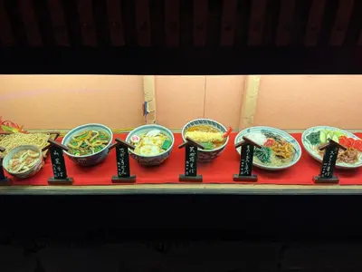 a group of bowls of food on a table at \u6c60\u888b\u672c\u753a201 in Tokyo