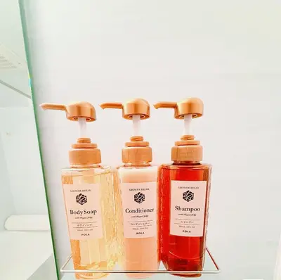 three bottles of soap sitting on a shelf at \u6c60\u888b\u672c\u753a201 in Tokyo