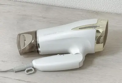 a hair dryer sitting on a table with a brush at \u30a2\u30b9\u30d4\u30a2503 in Tokyo