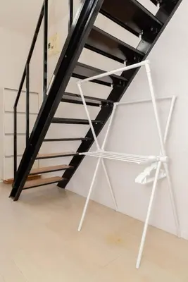 a black and white staircase in a white room at Villa Jujo in Tokyo