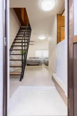a hallway with a staircase in a house at Villa Jujo in Tokyo