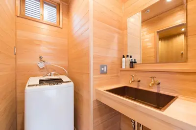 a small bathroom with a sink and a mirror at Ebihara in Tokyo