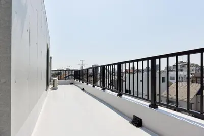 a balcony with a view of the city at \u30aa\u30fc\u30af\u30d6\u30e9\u30f3\u30ab\u5e61\u30f6\u8c37 in Tokyo