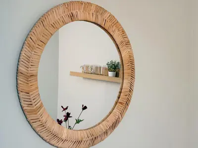 a wooden wicker mirror on a wall with a shelf at Nishisugamo hotel-TS0443 in Tokyo