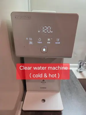 a water machine with a red sign on it at shibuya square 11F Shibuya Scramble Crossing near in Tokyo