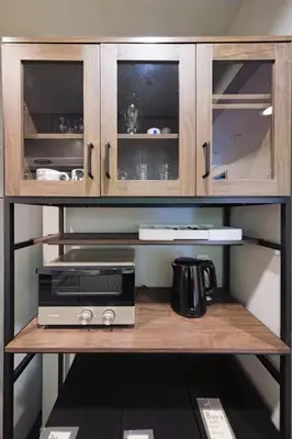 a microwave sitting on a shelf in a kitchen at shibuya square 11F Shibuya Scramble Crossing near in Tokyo