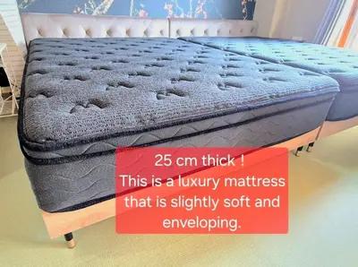 a bed with a sign that says cm thick at shibuya square 11F Shibuya Scramble Crossing near in Tokyo