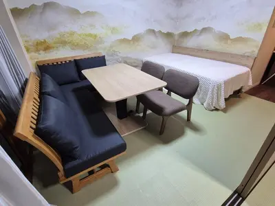 a room with a table and a couch and a table and chairs at shibuya square 11F Shibuya Scramble Crossing near in Tokyo