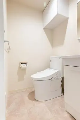 a white bathroom with a toilet and a sink at \u304b\u3064\u3089303 in Tokyo