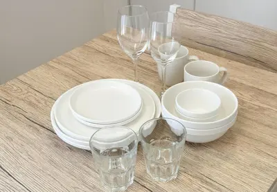 a table with white plates and glasses on it at \u304b\u3064\u3089303 in Tokyo