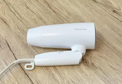 two white wii controllers sitting on a table at \u304b\u3064\u3089303 in Tokyo