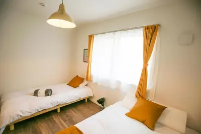 a room with two beds and a window at SCD2 Ikebukuro Commercial District Premium Homestay in Tokyo