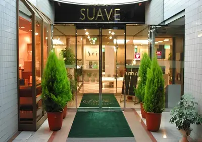 a store front with potted plants in front of it at \u30db\u30c6\u30eb\u30b5\u30fc\u30d6\u6e0b\u8c37 in Tokyo