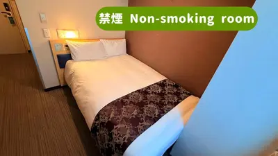 a room with a bed with a non smoking room at \u30db\u30c6\u30eb\u30b5\u30fc\u30d6\u6e0b\u8c37 in Tokyo