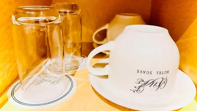two glass mason jars and a white pitcher on a table at \u30db\u30c6\u30eb\u30b5\u30fc\u30d6\u6e0b\u8c37 in Tokyo