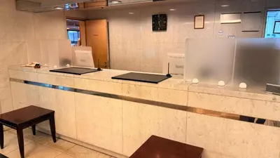 a counter in a room with two laptops on it at \u30db\u30c6\u30eb\u30b5\u30fc\u30d6\u6e0b\u8c37 in Tokyo